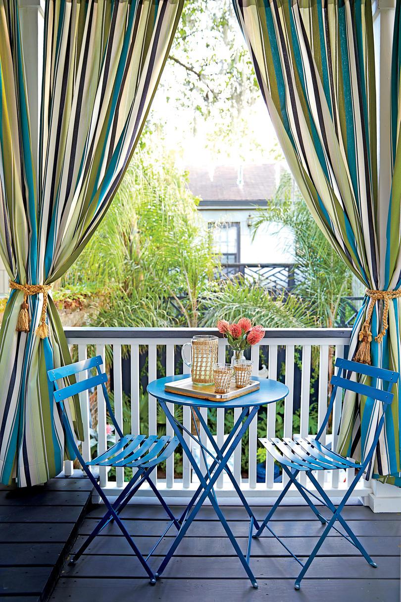 नीला Patio Chairs with Blue and Green Striped Curtains